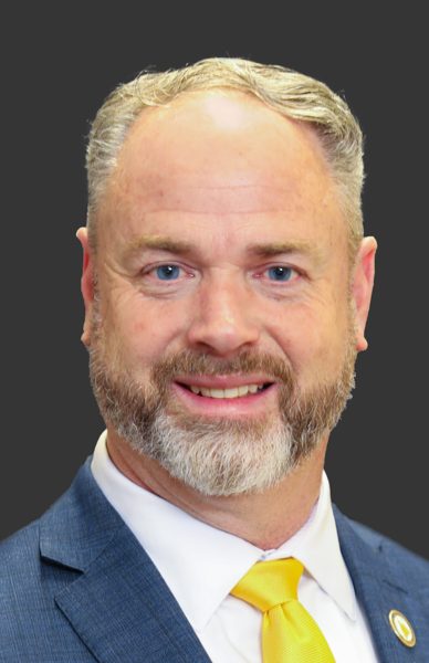 Official portrait of Derrick McCollum